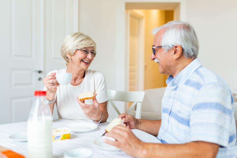 Elderly couple enjoying breakfast together